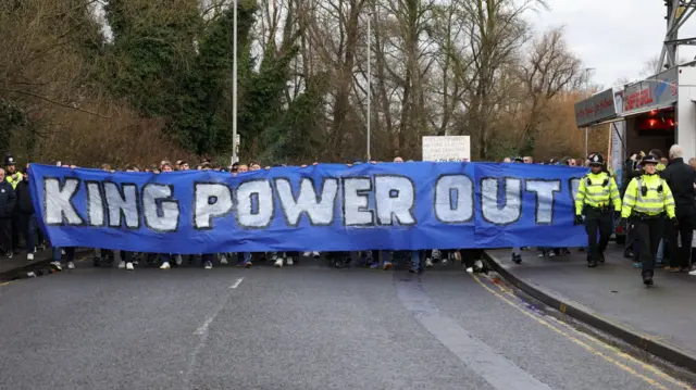 Leicester fans with a King Power Out banner before the game against Norwich City