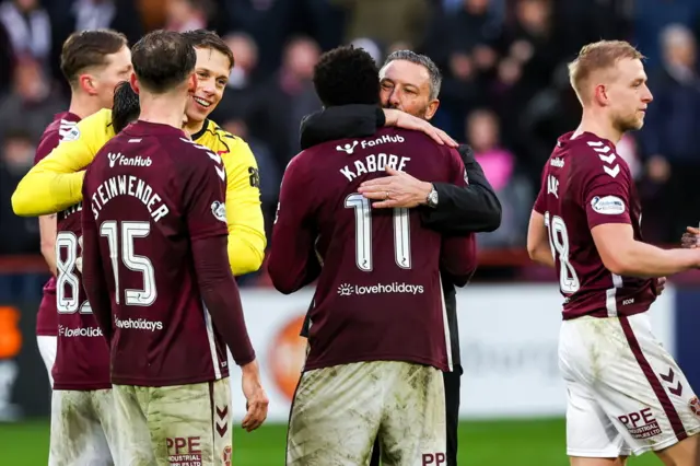 Hearts head coach Derek McInnes congratulates his players