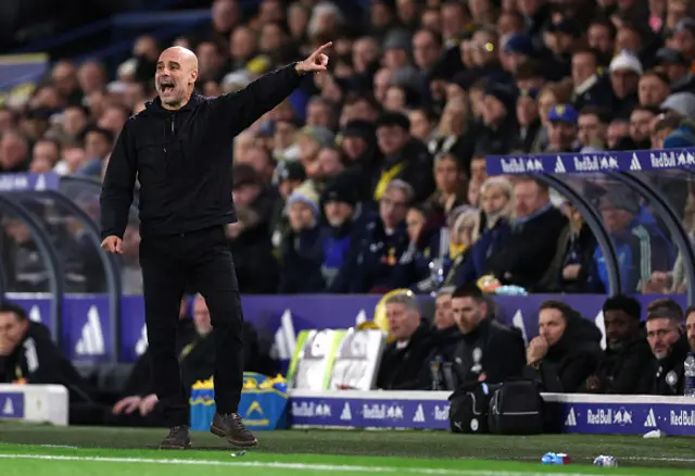 Pep Guardiola, Manager of Manchester City, gestures