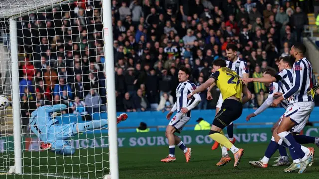 Will Lankshear scores for Oxford against West Brom