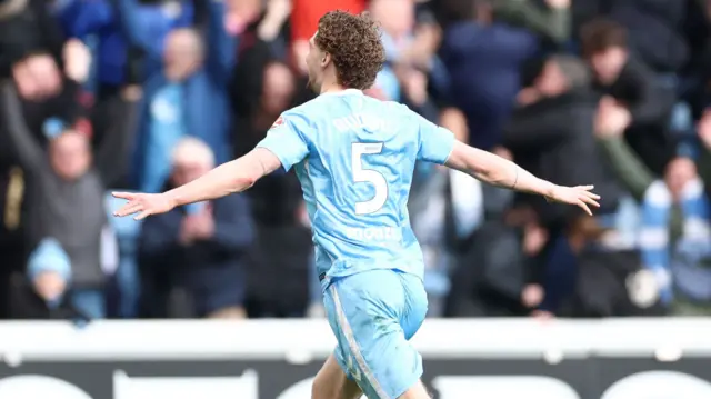 Jack Rudoni celebrates with his arms outstretched