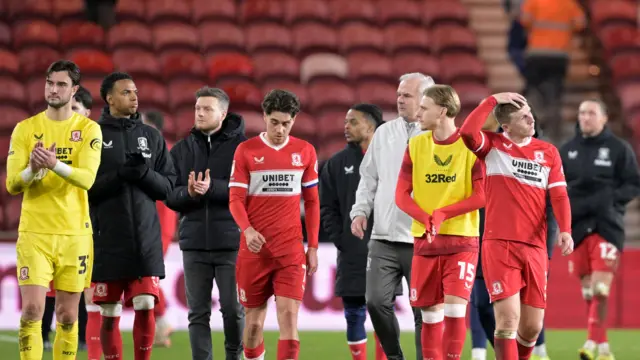 Middlesbrough players and coaching staff looking a bit despondent after drawing with Leicester