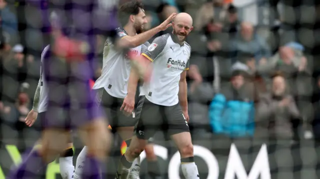 Derby goalscorer Matt Clarke celebrates with Ben Brereton Diaz