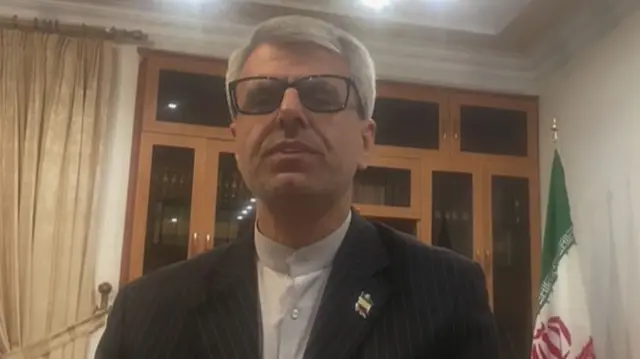 Iranian Foreign Ministry spokesman Esmail Baghaei speaking from an office.