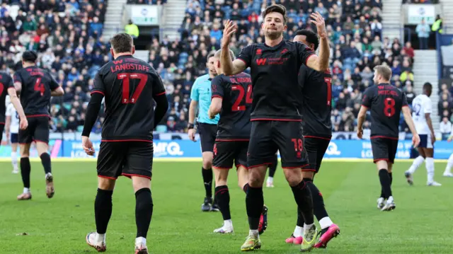 Millwall players celebrate at Deepdale