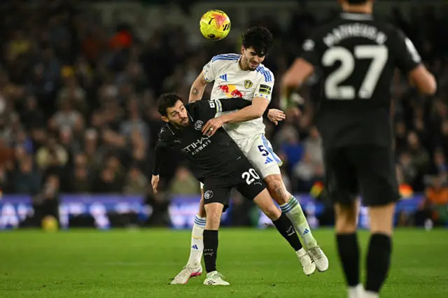 Manchester City's Portuguese midfielder #20 Bernardo Silva (L) vies with Leeds United's Dutch defender #05 Pascal Struijk