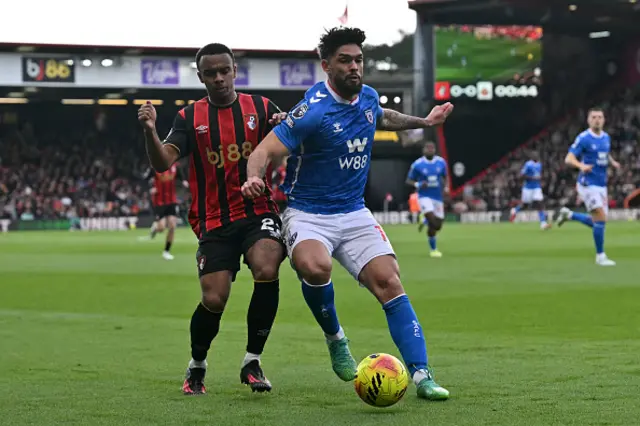 Bournemouth's French striker Eli Junior Kroupi (L) vies with Sunderland's Paraguayan defender Omar Alderete
