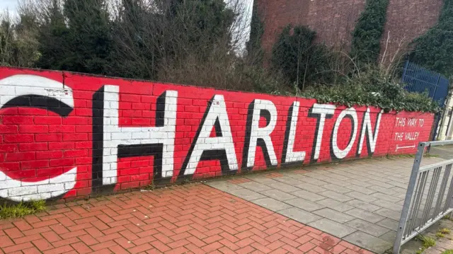 The word 'Charlton' sprayed in red white and black on a wall near the Valley Stadium