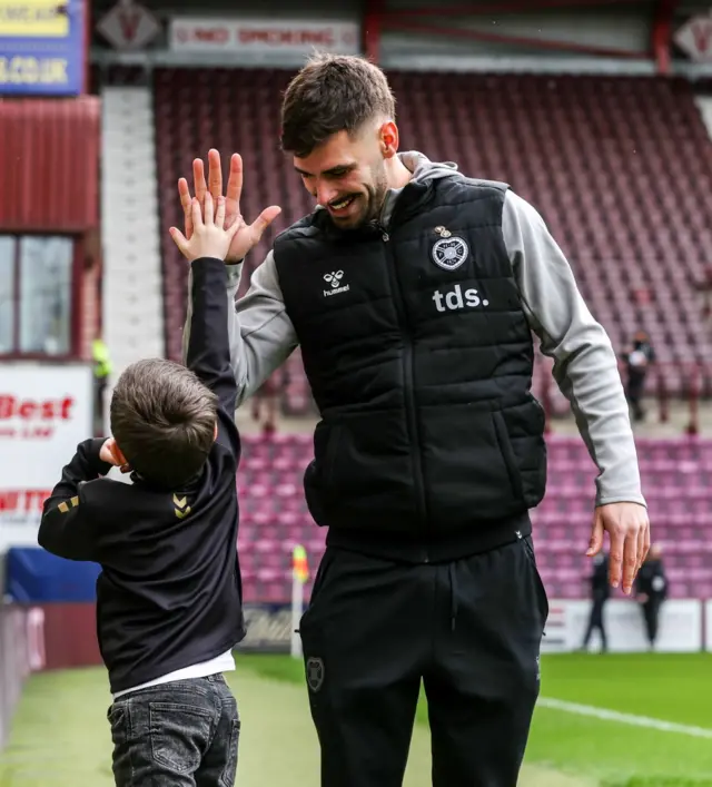 Hearts striker Claudio Braga arriving at Tynecastle