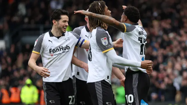 Derby players celebrate with goalscorer Rhian Brewster