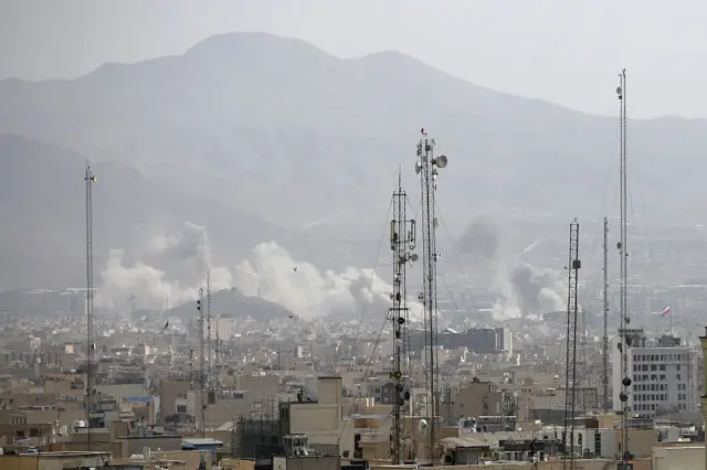 Smoke rises over the city center after an Israeli army launches 2nd wave of airstrikes on Iran.