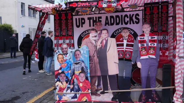 A merchandise stall outside The Valley, selling Charlton and Wrexham scarves