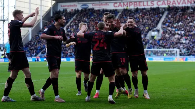 Ryan Leonard celebrates with his Millwall team-mates at Deepdale