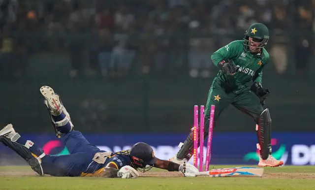 sman Khan of Pakistan attempts to run out Charith Asalanka of Sri Lanka during the ICC Men's T20 World Cup India & Sri Lanka 2026 Super 8 match between Sri Lanka and Pakistan at Pallekele Cricket Stadium