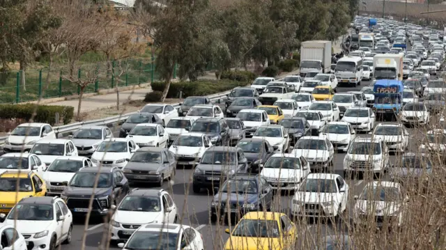 Queues of cars in Tehran earlier on Saturday