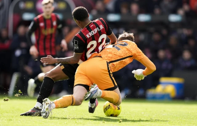 Bournemouth's Eli Junior Kroupi is challenged by Sunderland goalkeeper Robin Roefs