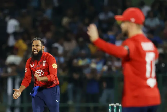 England's Adil Rashid reacts