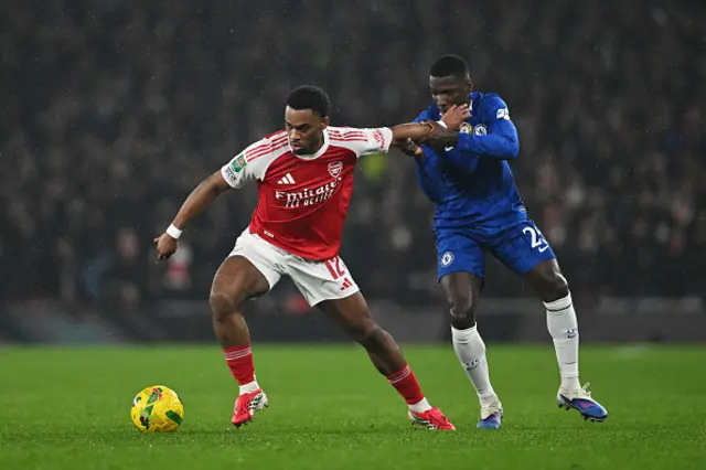 Jurrien Timber of Arsenal controls the ball whilst under pressure from Moises Caicedo