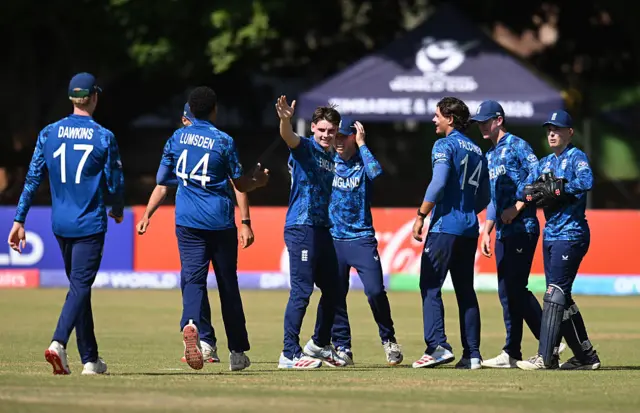 Manny Lumsden of England celebrates the wicket of Alex Lee-Young of Australia