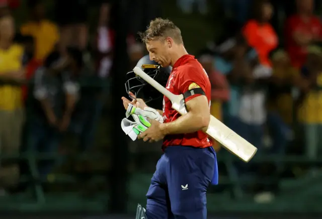 England's Jos Buttler walks after losing his wicket
