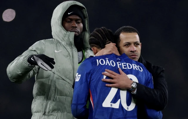 Chelsea manager Liam Rosenior hugs Chelsea's Joao Pedro at the end of the match