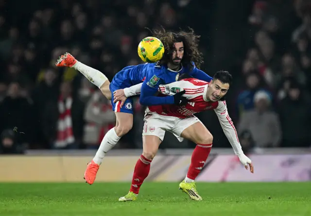 Gabriel Martinelli of Arsenal is challenged by Marc Cucurella