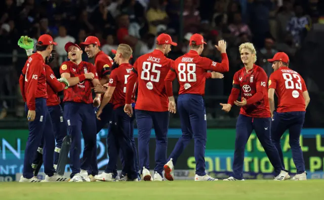 England's Jacob Bethell celebrates with teammates after taking the wicket of Sri Lanka's Dasun Shanaka, stumped out by England's Jos Buttler