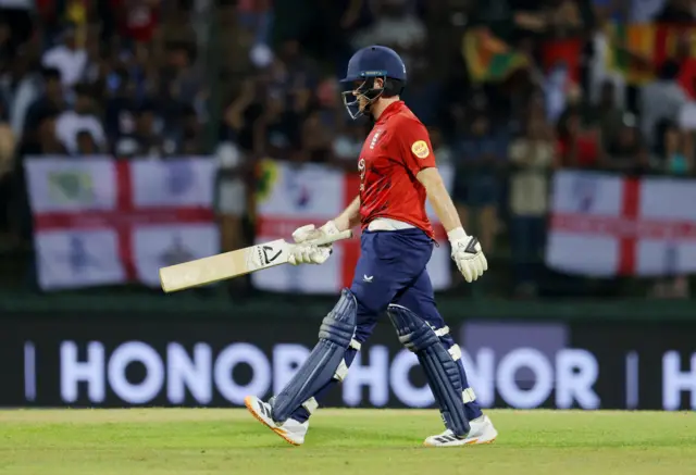 England's Liam Dawson walks after losing his wicket