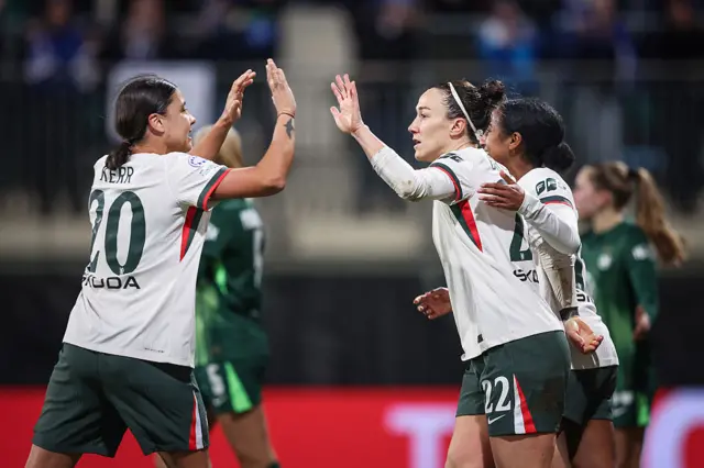 Lucy Bronze celebrates scoring v Wolfsburg