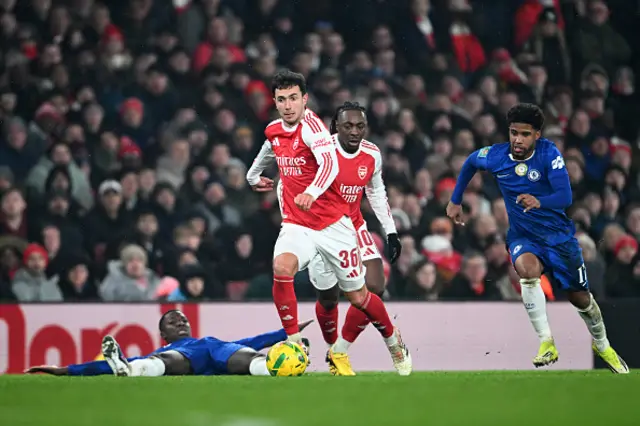 Martin Zubimendi of Arsenal runs with the ball whilst under pressure from Andrey Santos