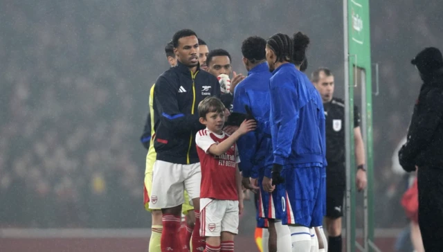 Arsenal's Gabriel (left) shakes hands with Chelsea players ahead of the Carabao Cup semi-final second leg match