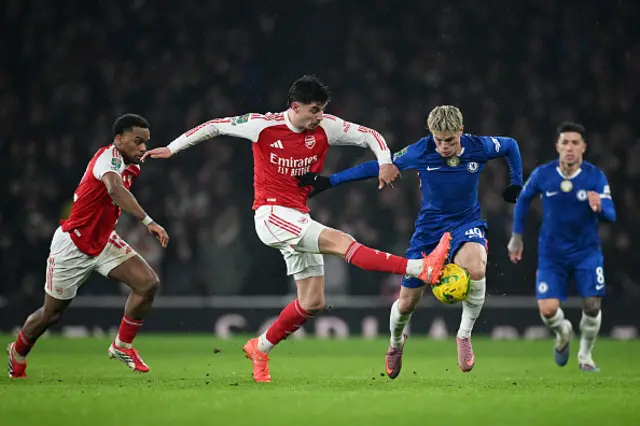 Kai Havertz of Arsenal is challenged by Alejandro Garnacho