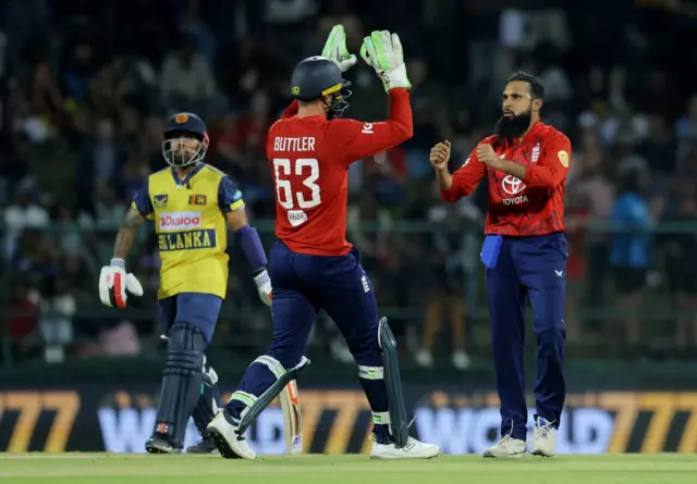 England's Adil Rashid celebrates with England's Jos Buttler after taking the wicket of Sri Lanka's Pavan Rathnayake