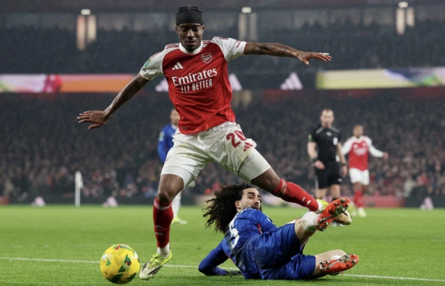Arsenal's Noni Madueke in action with Chelsea's Marc Cucurella
