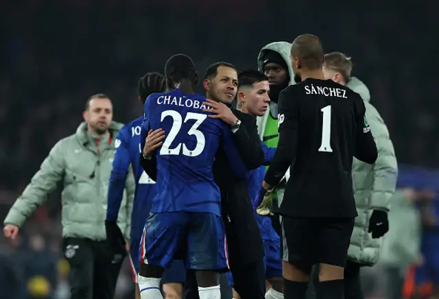 Liam Rosenior, Manager of Chelsea, embraces Trevoh Chalobah and Robert Sanchez