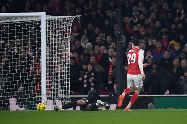 Kai Havertz of Arsenal scores their first goal past Chelsea goalkeeper Robert Sanchez