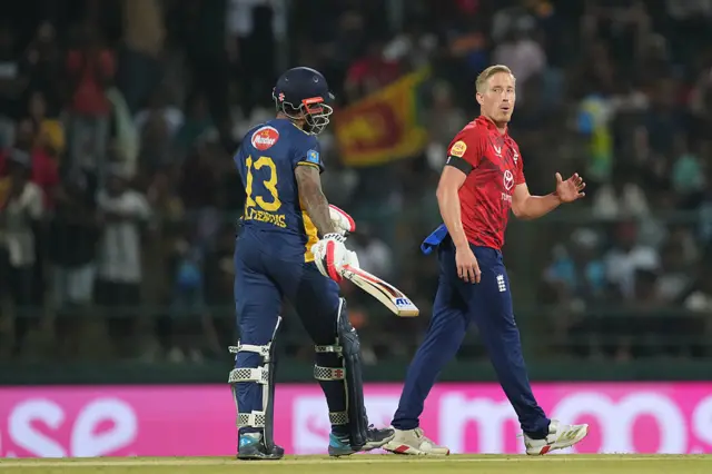 Luke Wood (R) of England looks at Kusal Mendis (L) of Sri Lanka d