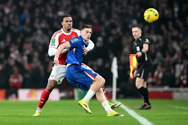 Gabriel of Arsenal and Liam Delap of Chelsea battle for possession of the ball