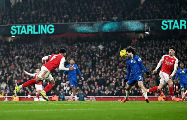 Gabriel of Arsenal heads the ball into Marc Cucurella