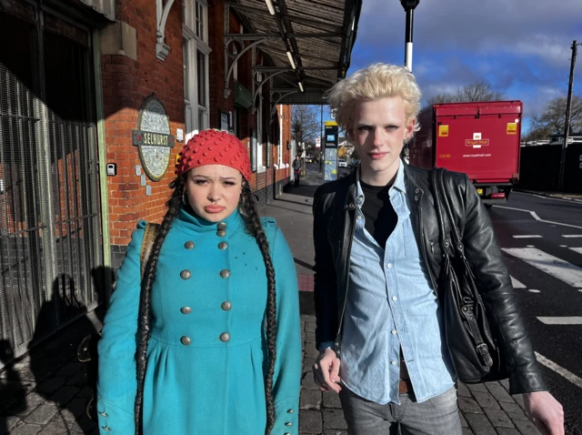 Two passengers pictured outside Selhurst station