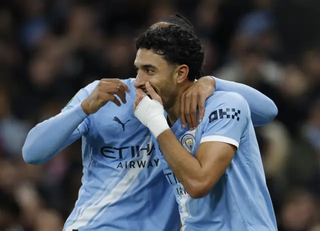Manchester City's Omar Marmoush celebrates scoring their first goal with Antoine Semenyo