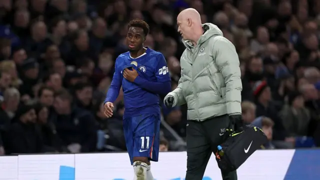 Jamie Gittens alongside Chelsea's physio