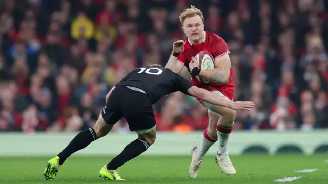 Blair Murray runs with the ball for Wales against New Zealand