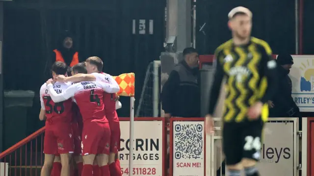 Accrington celebrate Alex Henderson's goal against Salford