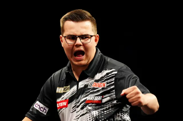 Netherlands' Gian van Veen celebrates winning his match against England's Luke Littler during the BetMGM Premier League Darts at the Utilita Arena, Newcastle upon Tyne