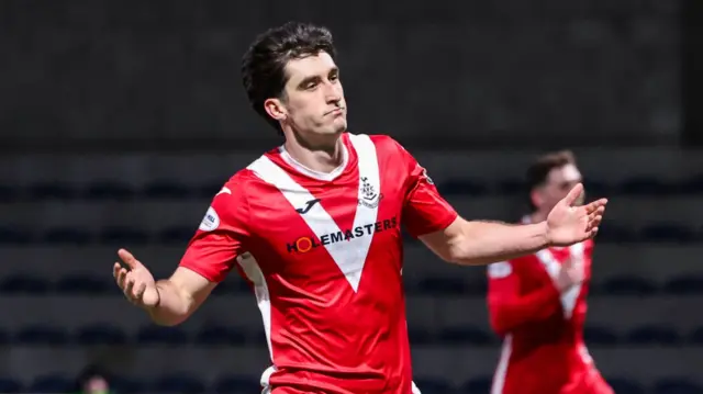 Mochrie celebrates a goal against Raith Rovers