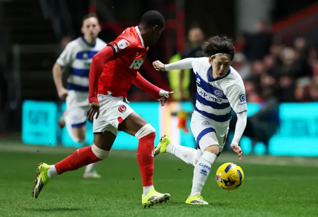 Koki Saito of Queens Park Rangers is challenged by Kayne Ramsay of Charlton Athletic