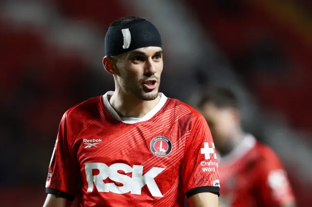 Conor Coady of Charlton Athletic looks on, whilst wearing a bandage on his head after picking up an injury