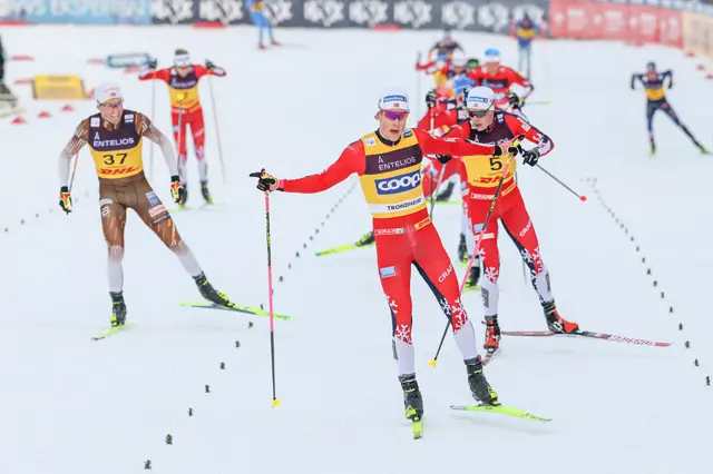 Norway's Johannes Hosflot Klaebo crosses the finish line to win the men's skiathlon 10km classic + 10 km free event