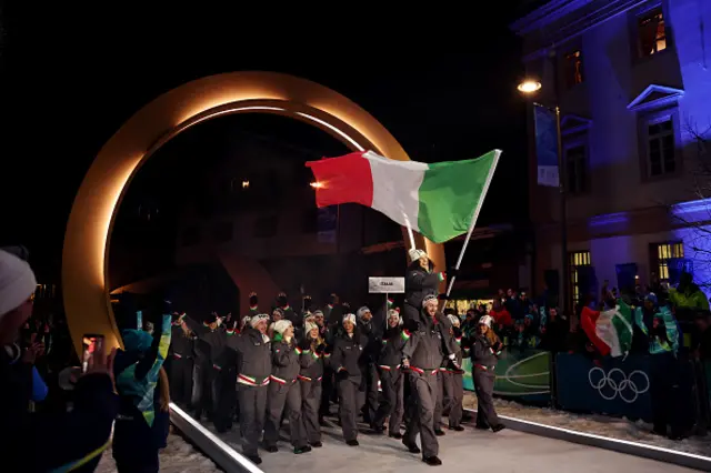 Flagbearers Amos Mosaner and Federica Brignone of Team Italy